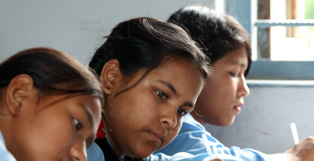 Adolescent girls study in Nepal. Photo: Jim Holmes/AusAID