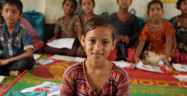 A young Rohingya refugee girl in a UNICEF temporary learning centre funded by UKAid in Cox’s Bazar. Photo: Russell Watkins/DfID