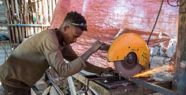 An adolescent boy working as a metal worker in Ethiopia. Photo: Nathalie Bertrams/GAGE 2020