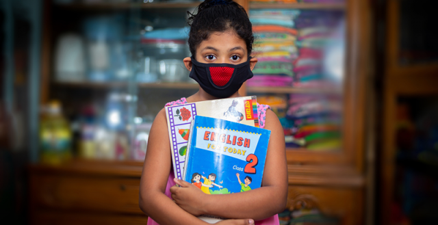 A teenage girl wearing a protective cloth mask against transmissible COVID-19 diseases in Dhaka. Photo: Jahangir Alam Onuchcha/Shutterstock.com